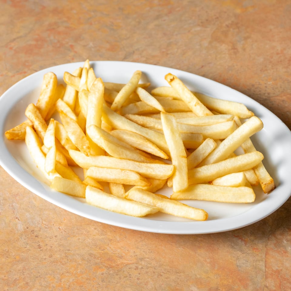French fries on a white plate.